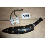 Carved horn Kukri dagger with inlaid horn sheath, and painted enamel decanter label "Madeira"