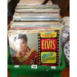 Crate of assorted vinyl LPs including Genesis, Elvis etc and a signed copy of "Around the World with