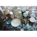 Quantity of studio pottery jugs and cups, inc. Lowerdown and Rye