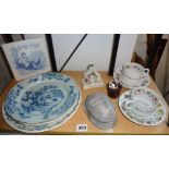 Two Delft plates (A/F), a Minton blue and white tile (A/F), a Fairing, 2 cups and saucers with