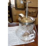 1930's patented cocktail mixing machine with cut glass base and silver plated lid and mechanical