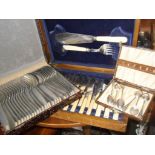 Three cased sets of cutlery