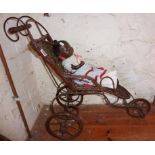 Cane and wrought iron doll's push chair together with vintage black doll