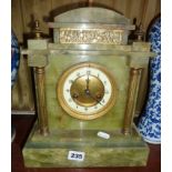Victorian brass pillared and embellished onyx marble mantle clock, the brass dial marked Rumbold,