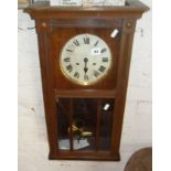 Oak wall clock with bevelled glass panels to door