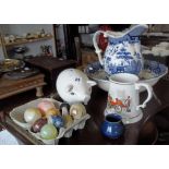 Nine various marble eggs, a china pig money bank, and a blue & white jug & basin set