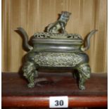 A Chinese bronze two-handled censer with piercing and lion dog finial to lid, Xuan De 6 character