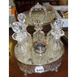 Victorian six bottle cruet set in pierced silver plated stand