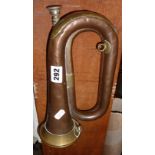 A copper and brass bugle by Hawkes & Son, London, inscribed B.P.S, 1st R.T., 7