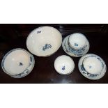 Five 18th c. Worcester blue and white tea bowls, four saucers and two bowls, most with crescent