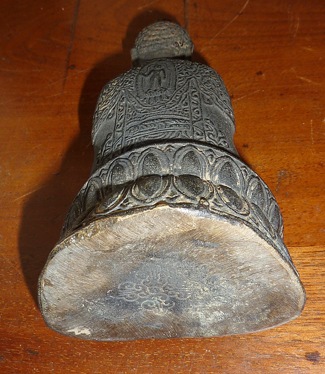 A Tibetan bronze figure of a seated Shakyamuni buddha - stamp on base, approx 13cm high - Image 2 of 2