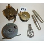 Three small brass fishing reels and three pocket corkscrews