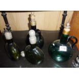 Four early 19th c. green glass wine flagons