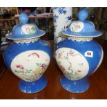 Pair of powder blue Chinese porcelain Famille Rose covered vases with Qianlong marks (chip to