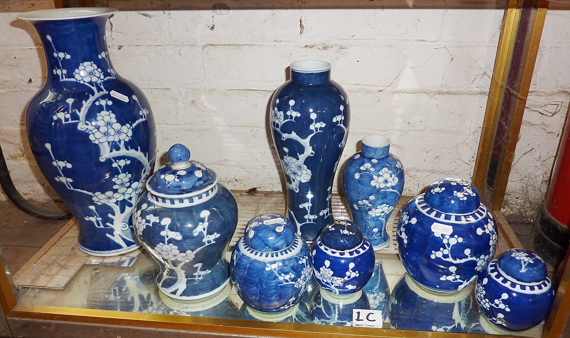 Eight Chinese porcelain blue and white prunus vases and ginger jars, some with covers