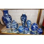 Eight Chinese porcelain blue and white prunus vases and ginger jars, some with covers