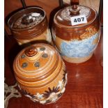 Three various Doulton stoneware tobacco jars