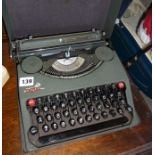 An Empire grey metal portable typewriter