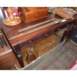 19th c. mahogany writing table with two drawers on turned and fluted legs