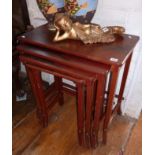 Nest of four oriental red lacquered tables