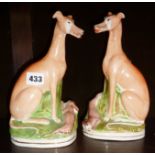 Pair of Staffordshire greyhound figures with rabbits at their feet (one A/F)