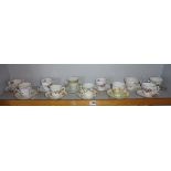 Eleven assorted china coffee cans and saucers