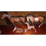 Two Beswick horses and two foals