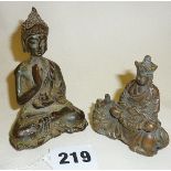 A Tibetan bronze figure of a seated Buddha and a Chinese bronze figure of a priest riding a kylin