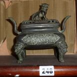 Chinese bronze censer having two handles and lion dog finial to cover, Xuan De stamp to base