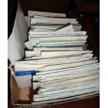 Box containing unsorted vintage and older postcards