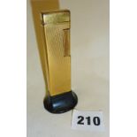 Unusual vintage gold-coloured Dunhill table lighter with bakelite stand