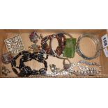 Tray of vintage costume jewellery including a Chinese jade pendant carved with a dragon