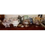 Silver-plated and china teapots, some Victorian, etc.