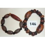Tibetan "dragon eye" agate Dzi bead bracelet and a "9-eyed" agate Dzi bead bracelet.