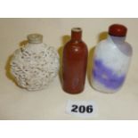 Three snuff bottles, two Chinese porcelain and one Peking glass