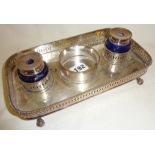Silver plated inkstand with two blue cut glass ink bottles, beaded and pierced edging