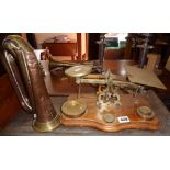 Antique brass letter scales on wooden base with brass weights and a copper and brass bugle by Hawkes