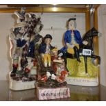 Three figural Staffordshire flatbacks entitled The Rival, Cockfighting and Dick Turpin