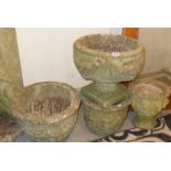 Four stonework garden urns