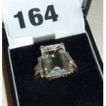 9ct gold ring set with a very pale blue stone (small crack to one corner)