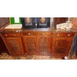 Late Victorian mahogany breakfront sideboard having three drawers above panelled doors