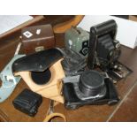 Canon Canonet camera, a Daci camera, Fujica compact and a folding Autographic Brownie with a