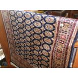 Modern Bokhara rug on blue ground, 1.90m x 1.40m