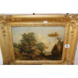 19th c. oil on board of a rural scene with cottages and figure, in bold gilt frame