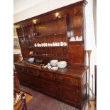 Georgian style cross-banded oak Farmhouse dresser with shaped frieze, the rack with two spice