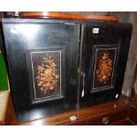 Late 19th c. ebonised two door table cabinet with marquetry panels to doors enclosing 12 drawers