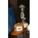 Treen turned wood Jockey's hat inkwell and a silver-plated putti figure on onyx base