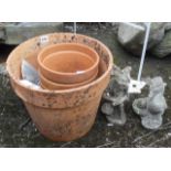 Three terracotta pots and two gnomes