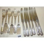 Six hallmarked silver table forks in the Kings pattern with six plated matching table knives.