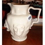 Staffordshire creamware jug with three character faces